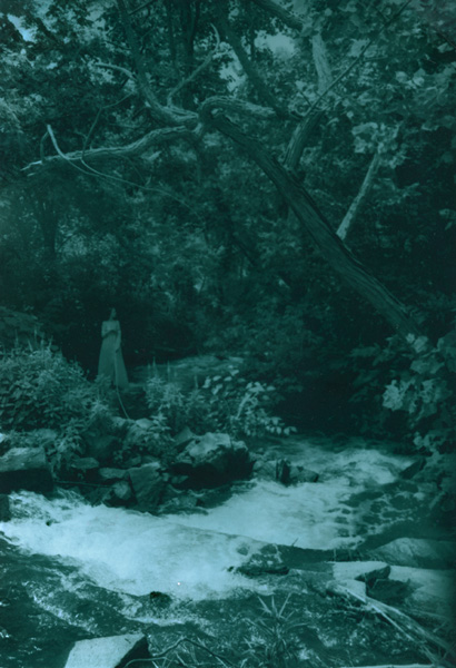 Woman by Running Stream