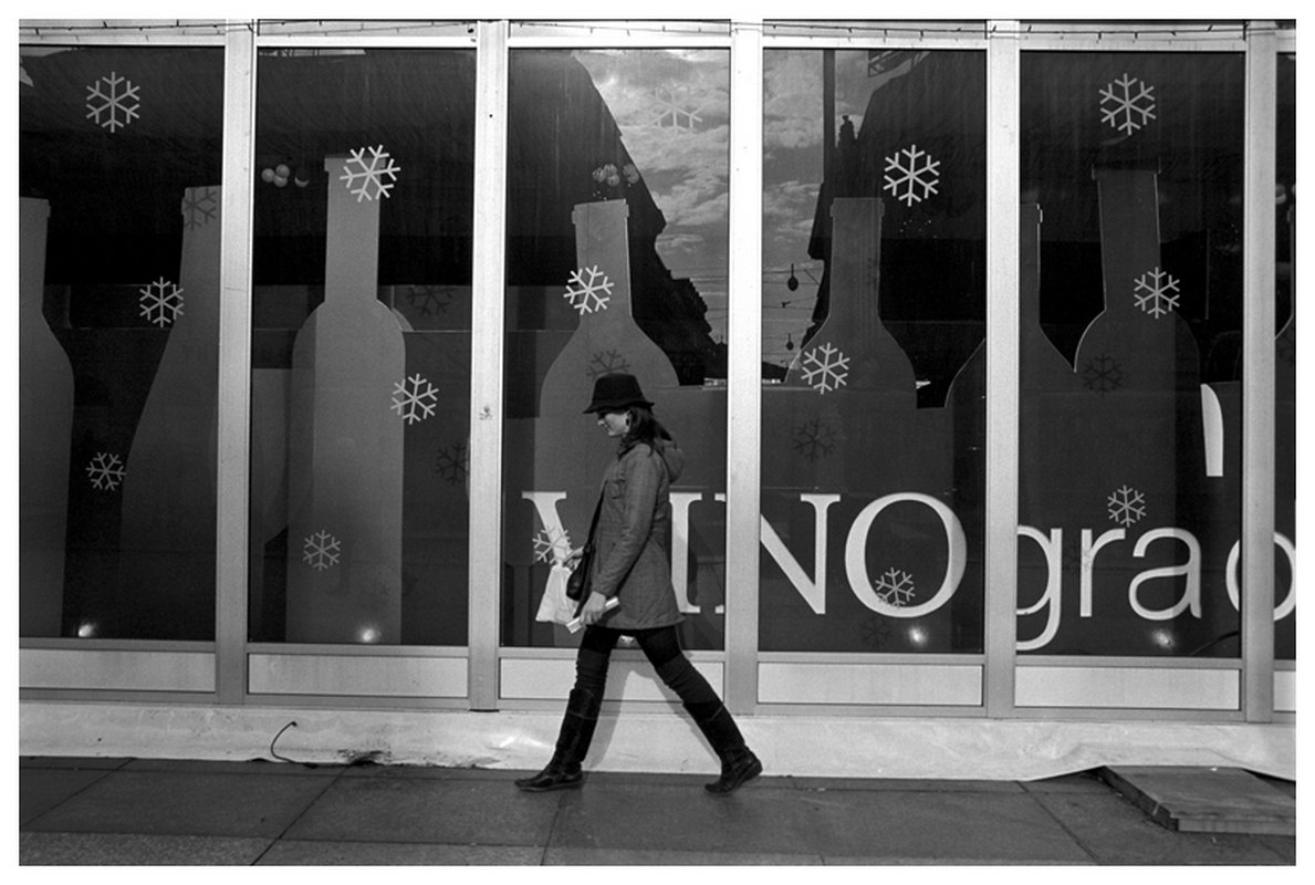 Woman in Front of Snowflake Window Display, Zagreb,Croatia