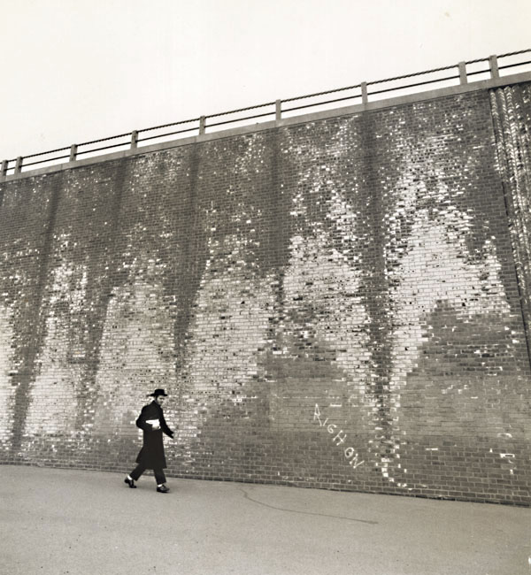 A Hassidic Rabbi Walks across a Highway Underpass, Brooklyn, NY A Hassidic Rabbi Walks across a Highway Underpass, Brooklyn, NY